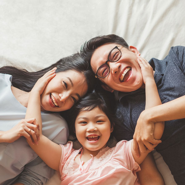 happy asian family of three